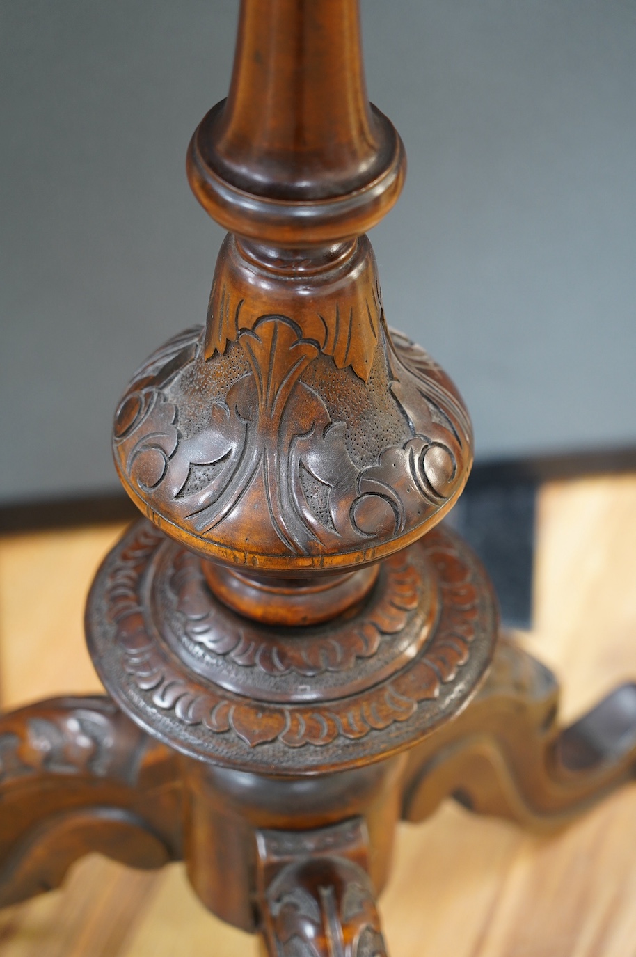 A Victorian carved walnut games table and chess pieces, table 74cm tall, king 6cm tall. Condition - good